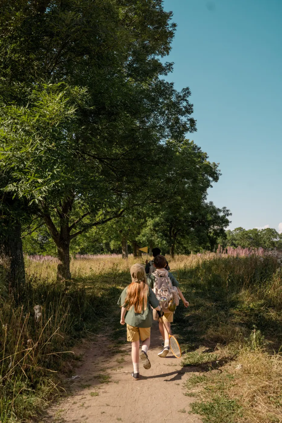 Children hiking up a hill